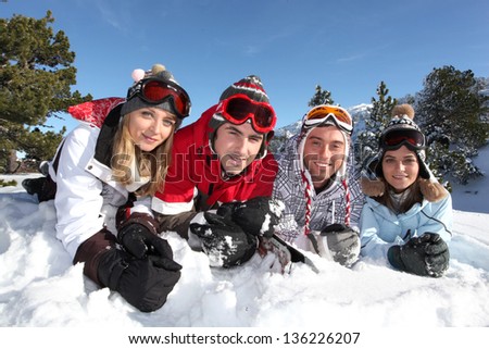 Four friends on skiing holiday