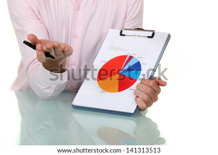 businessman showing pie chart at meeting