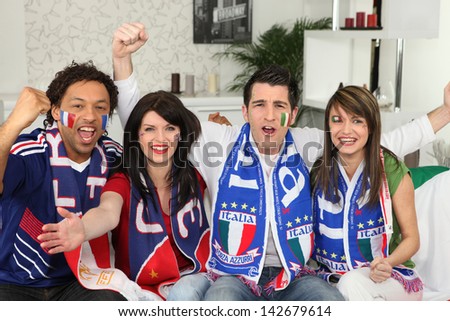 Group of friends supporting France and Italy