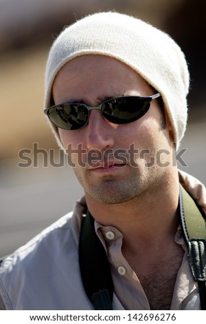 Man in sunglasses and beanie hat