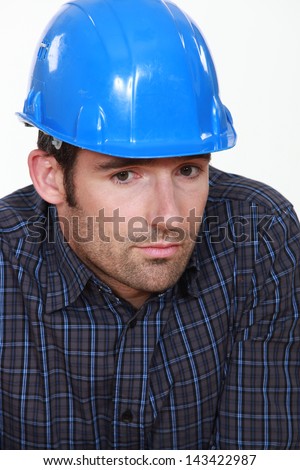 Portrait of tradesman lacking self-confidence