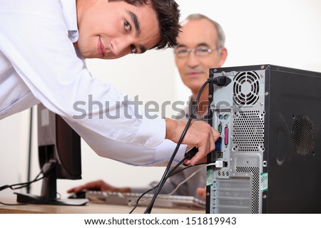 Computer technician repairing PC