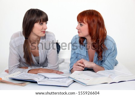 Two female friends studying.