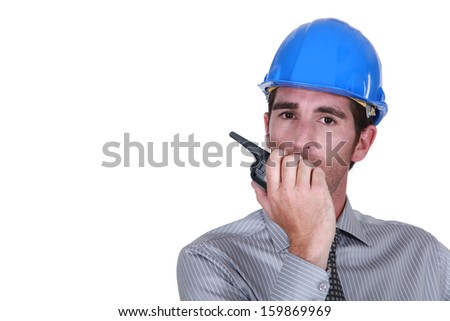 Engineer using a walkie-talkie