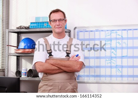 Man in store with arms crossed