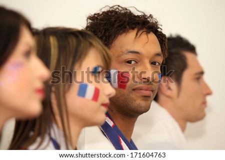 Four French sports fans stood in anticipation