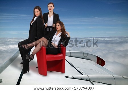 Businesswomen flying plane