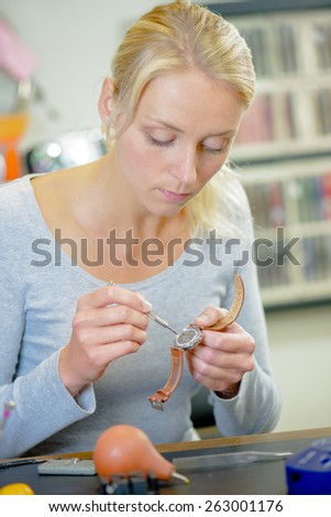 Female watch repair expert