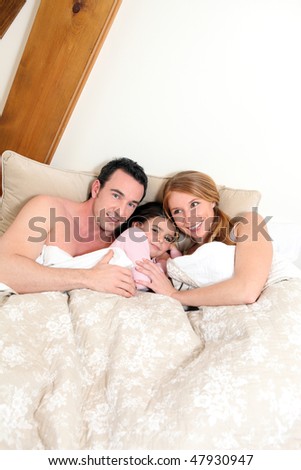 Family in bed in the morning