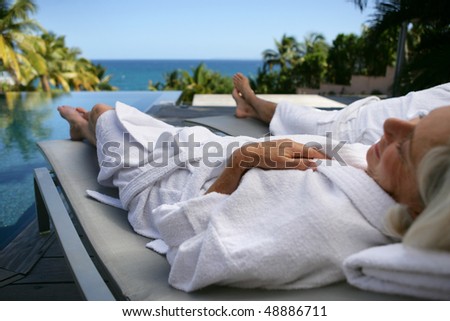 Senior woman resting on a deckchair