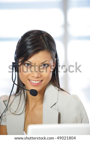 Portrait of smiling business woman with headset