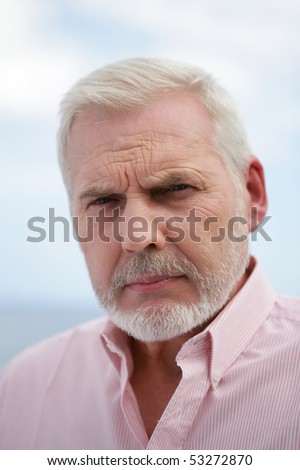 Portrait of a senior man frowning