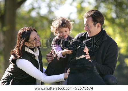 Portrait of a smiling family with a dog