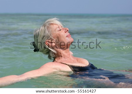 Portrait of a senior woman bathing in the sea