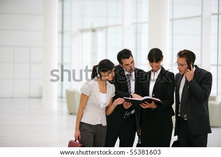 Business people in suit watching documents