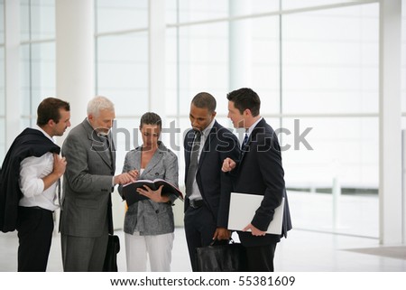 Business people in suit watching documents