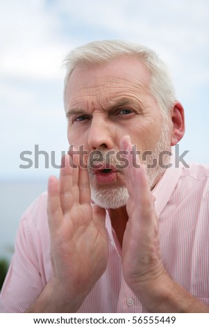 Portrait of a senior man whispering