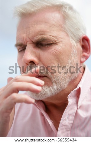 Portrait of a senior man pensive with eyes closed