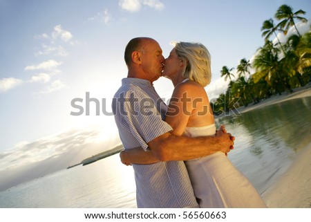 Two People Kissing On The Beach