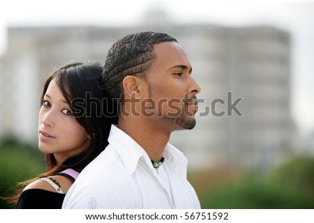 Portrait of a young couple back to back