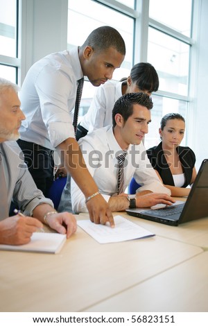 Business people in a meeting with a laptop computer