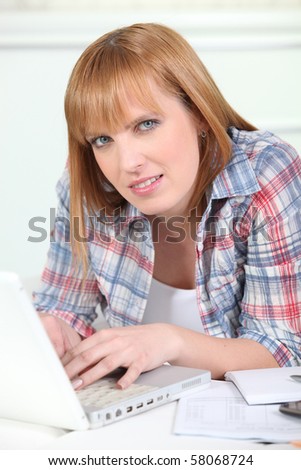 Portrait of a woman in front of a laptop computer