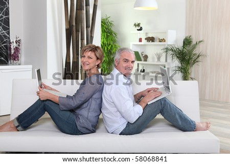 Senior couple in front of a laptop computer