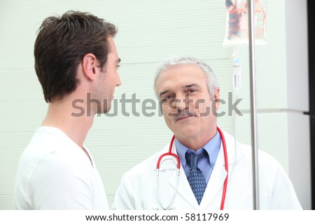 Patient with drip and doctor