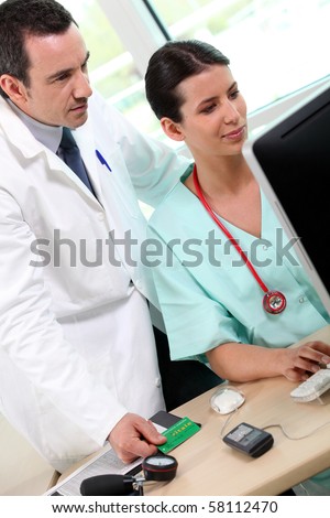 Doctor and medical assistant