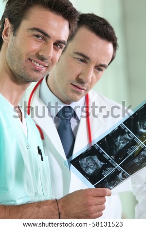Doctor and nurse watching a radiography
