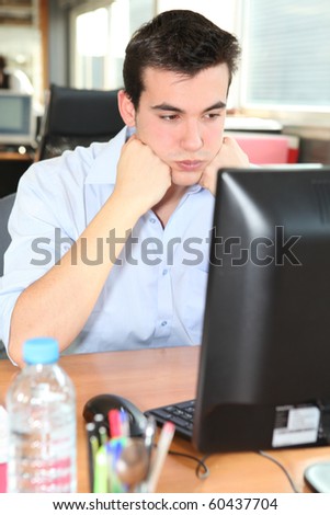 Angry young man at work