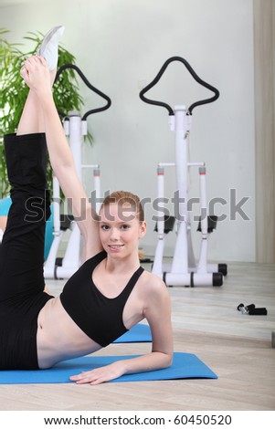 Young woman doing gymnastics