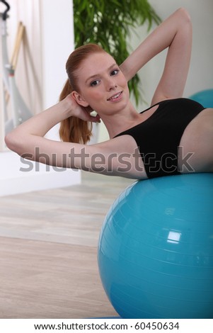 Young woman doing gymnastics