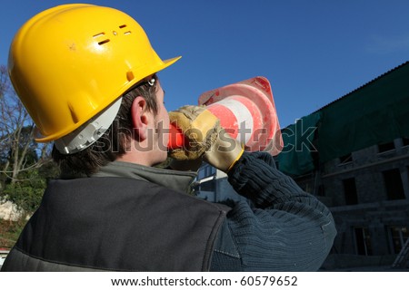 Worker talking in a safety cone
