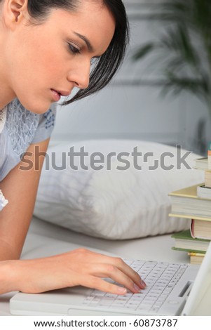 Portrait of a woman in front of laptop computer