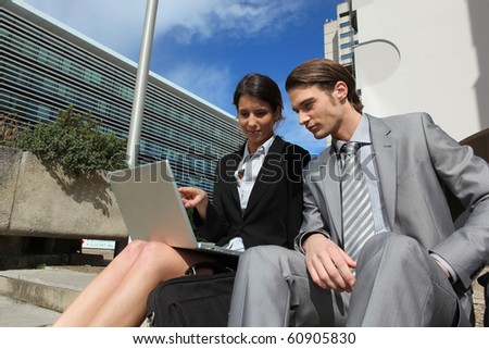Business people in professional meeting outdoors