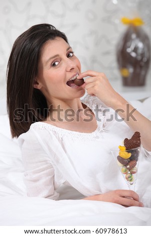 Portrait of a woman eating Easter eggs