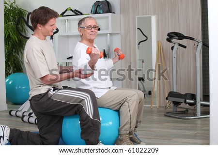 Senior woman and sports trainer