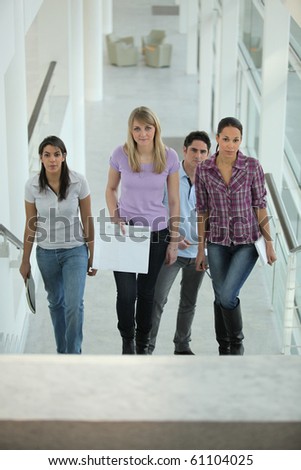 Group of young people climbing stairs