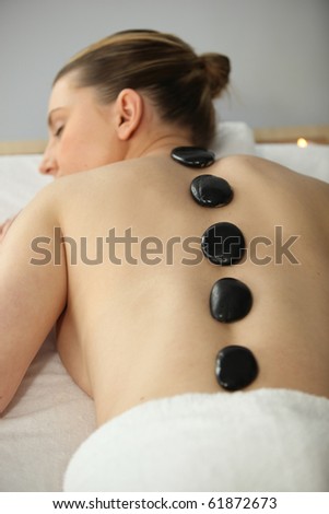 Woman with hot stones massage