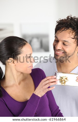 Man offering a gift to a woman
