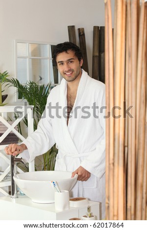 Man in bathrobe in the bathroom