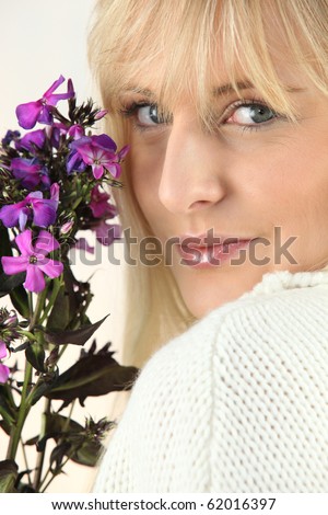 Portrait of a fair-haired woman with purple flowers