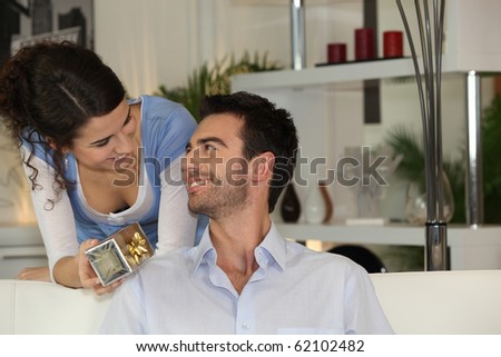 Woman offering a gift to her friend