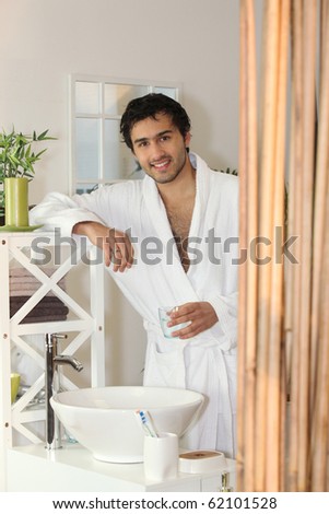 Man in bathrobe in the bathroom