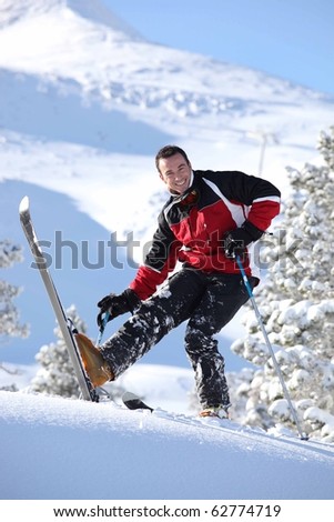 Young man on skis in snow
