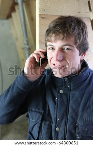 Young worker on phone