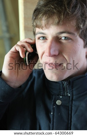 Young worker on phone