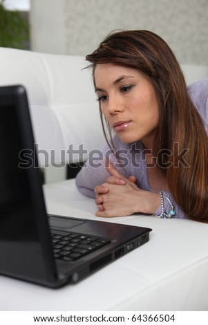 Portrait of a woman in front of a laptop computer