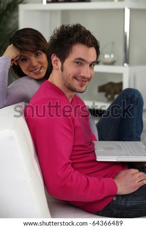 Man and woman in front of a laptop computer